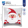 Cross-stitched Santa Claus design on a pillow with Vervaco branding and dimensions.