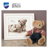 Teddy bear with a framed embroidery design and Vervaco logo.